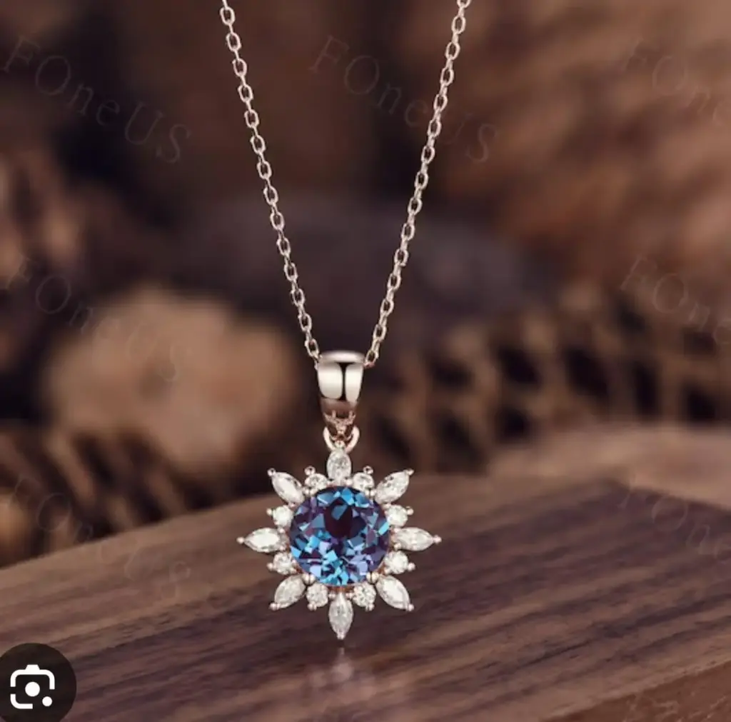 COLLAR DE FLOR CON PIEDRA AZUL ENMEDIO KENDRA SCOTT